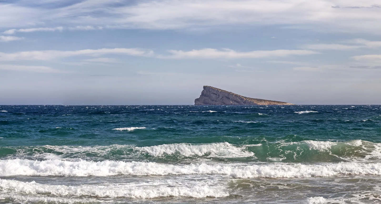 Waves rolling in with Benidorm Island behind