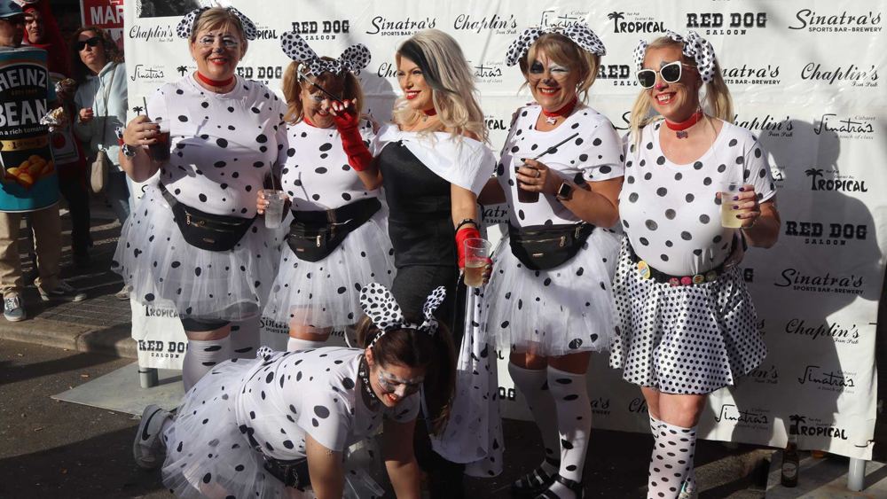 A group dressed as Cruella de Vil and her Dalmatians in spotty tutus, 2023