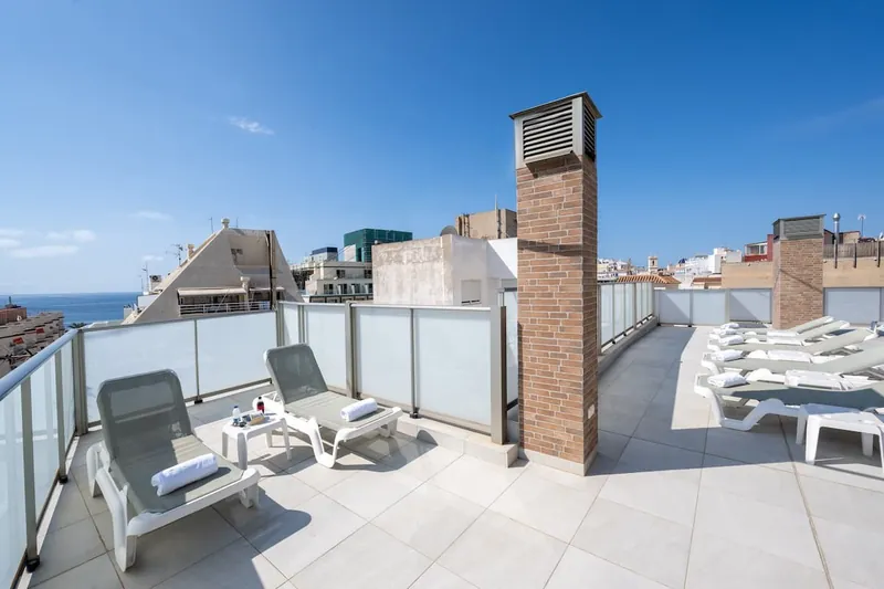 2Sleep: Roof terrace, Roof terrace with loungers and a sea glimpse