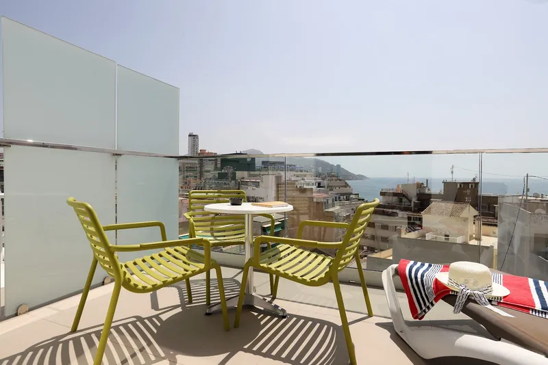 Alameda: Roof terrace, Terrace chairs and loungers with town and sea views