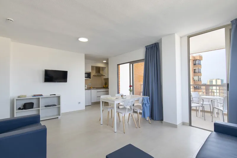 Levante Lux: Apartment lounge, Living area with sofas, dining table, kitchen and balcony