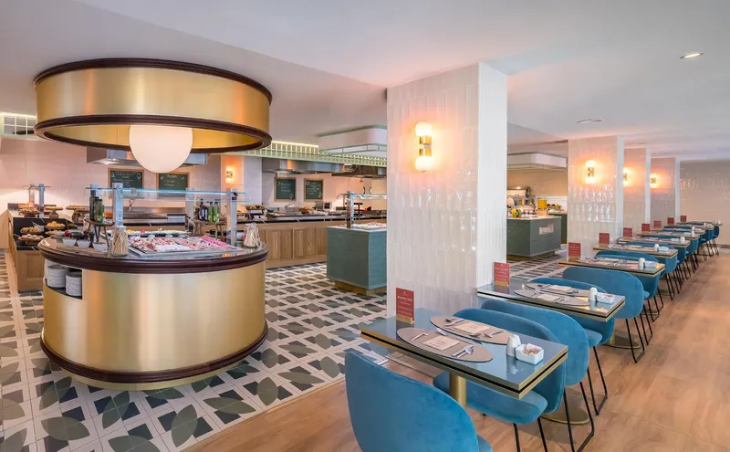 Barceló Beach: Buffet restaurant, Buffet stations with blue chairs and patterned floor tiles