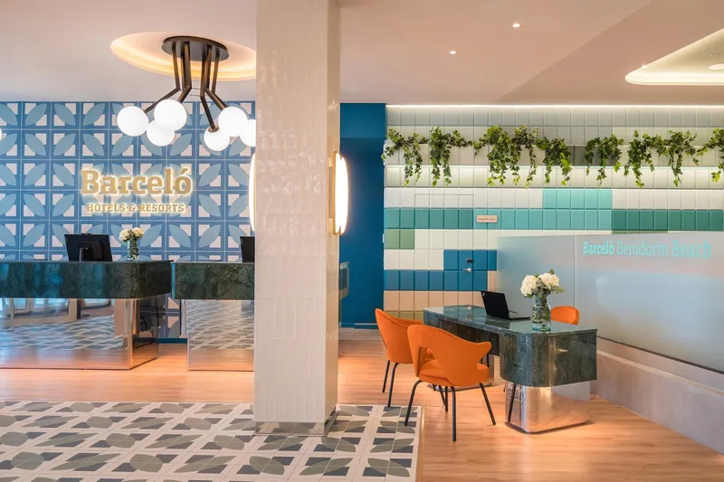 Barceló Beach: Reception, Reception desk with Barceló sign and orange chairs