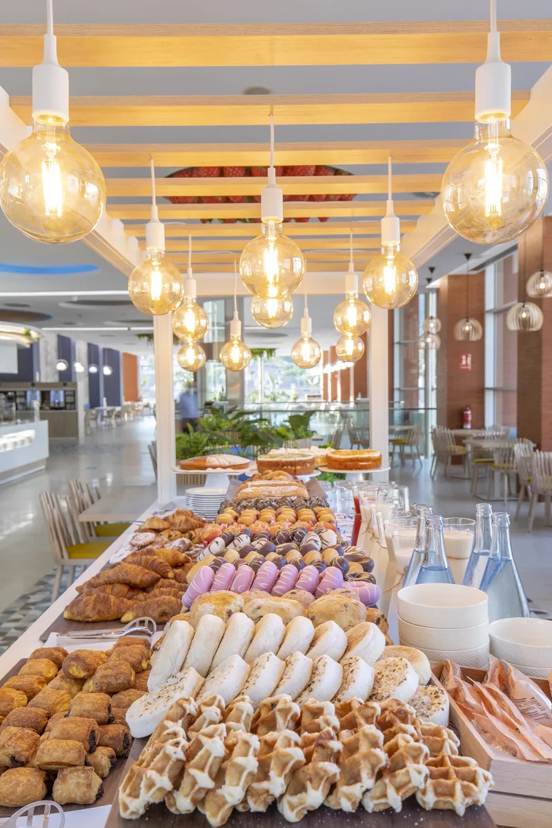 BCL Levante Club: Breakfast buffet, Pastry spread under hanging glass lamps