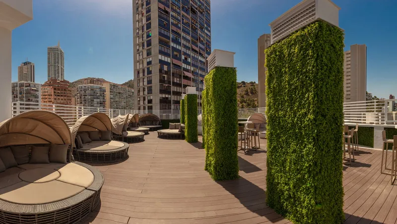 BC Music Resort: Roof terrace, Decked terrace with daybeds and green walls among towers