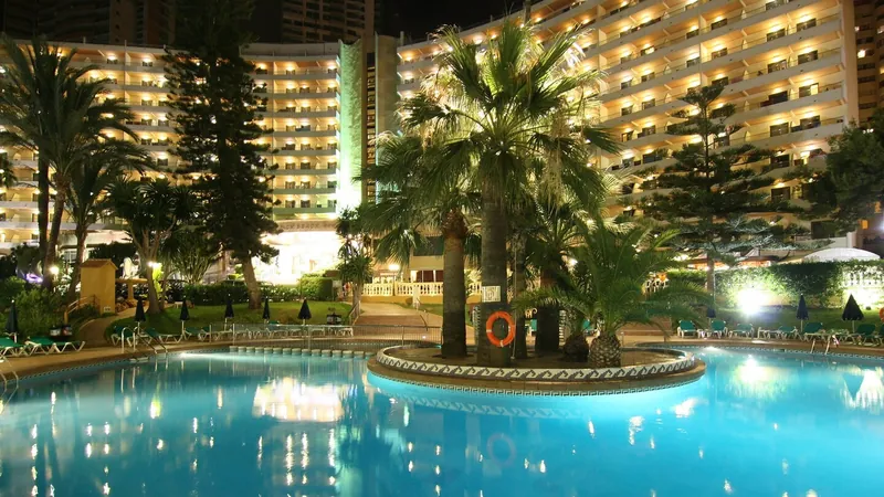 Benidorm East: Pool at night, The pool and hotel lit at night