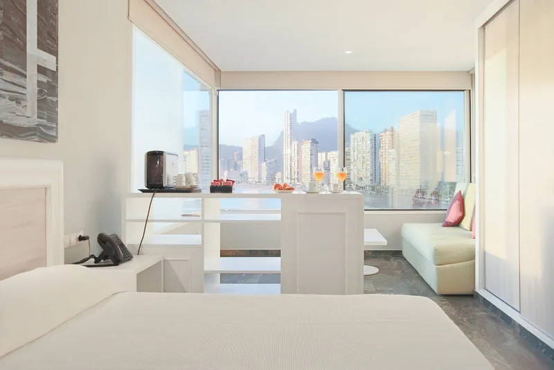 Benikaktus: Room with a view, Bright room with large windows facing the beachfront towers