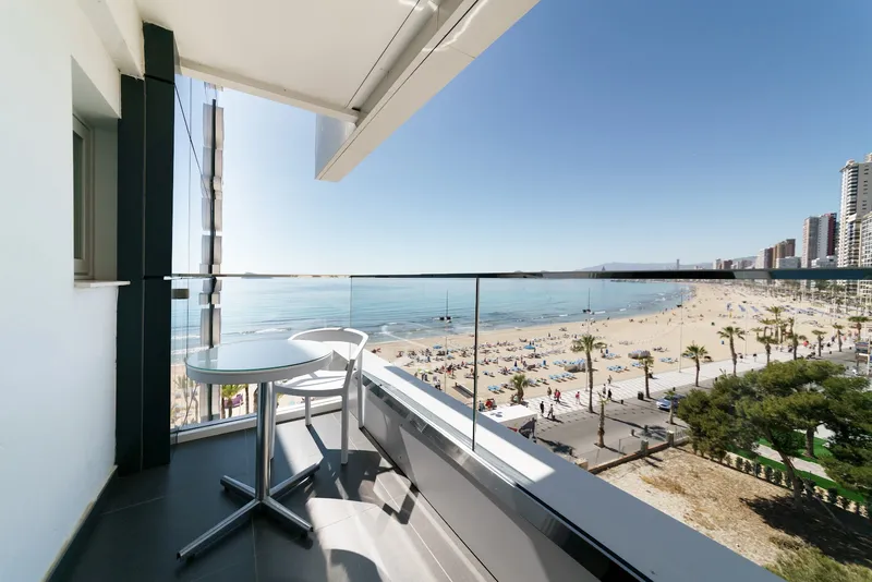 Brisa: Balcony view, Balcony table and chair above the beach