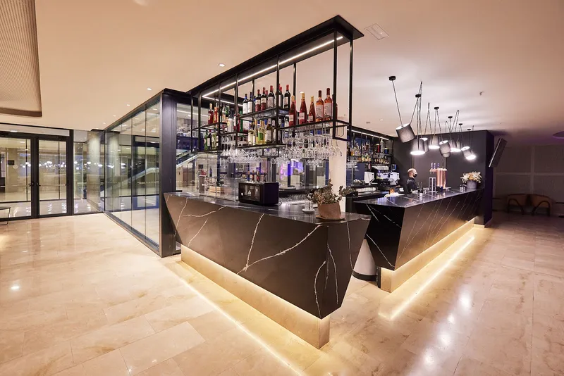 Bristol: Bar, Bar counter with lit base and bottle shelves