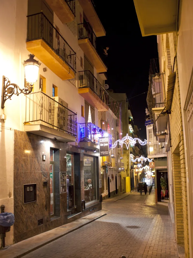Casa Don Juan: The street at night, Narrow old town street with lights at night