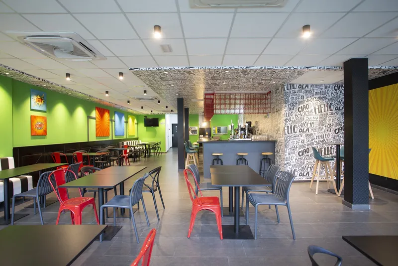 Casual Pop Art: Bar and lounge, Colourful bar area with tables and red chairs