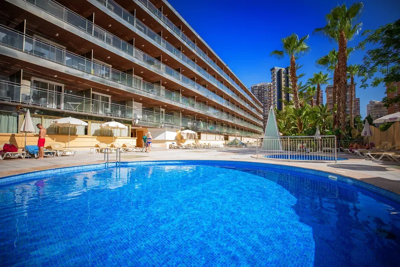 Diplomatic: Pool, Round pool with palms and the hotel's balconies