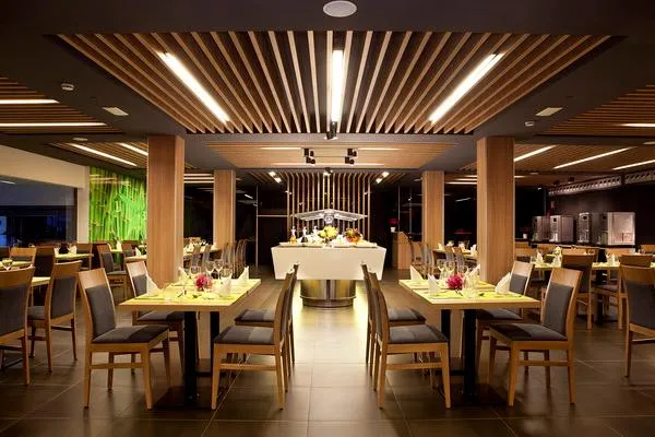 Flash: Restaurant, Laid tables in a dining room with timber ceiling slats