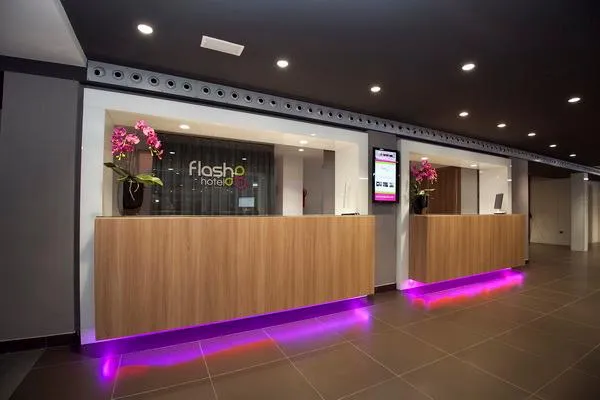Flash: Reception, Two wooden reception desks with purple under-lighting
