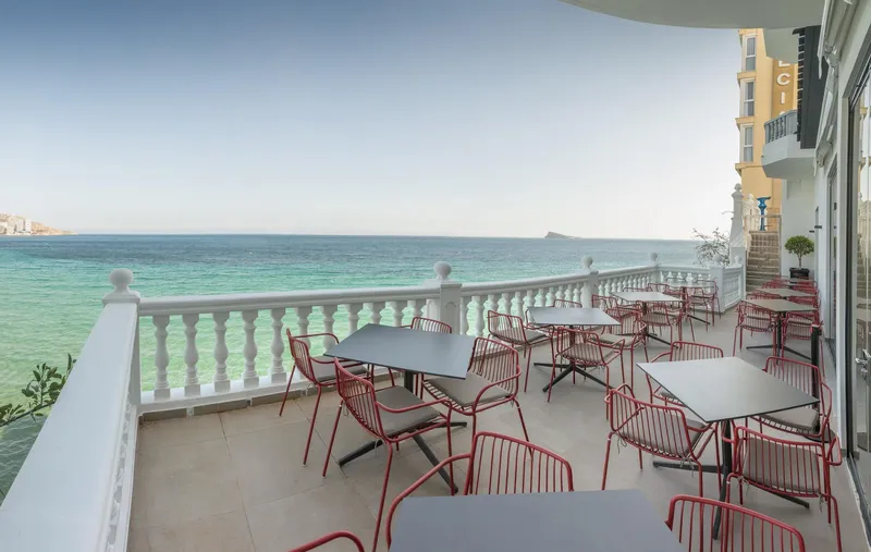 RH Canfali: Sea-view terrace, Terrace tables and red chairs above the sea