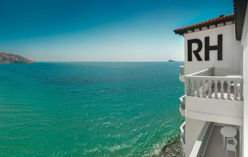 RH Canfali: The hotel, Building with RH sign above turquoise sea