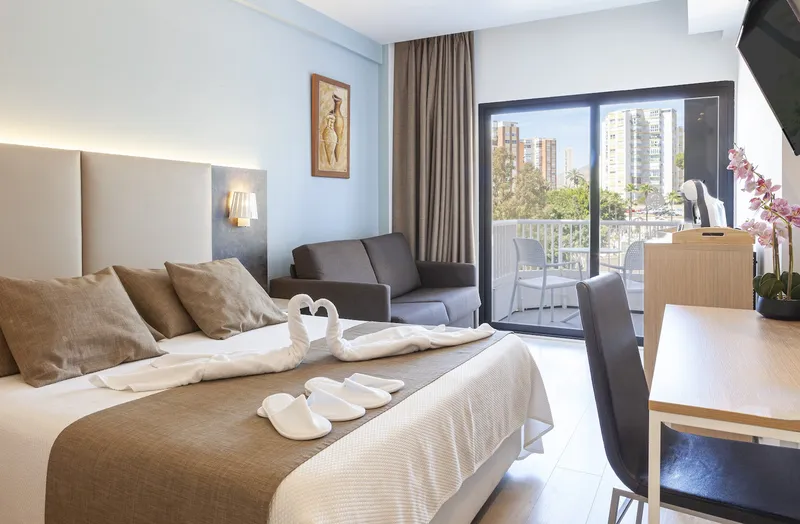 Golden: Double room, Double bed, sofa and balcony doors with city view