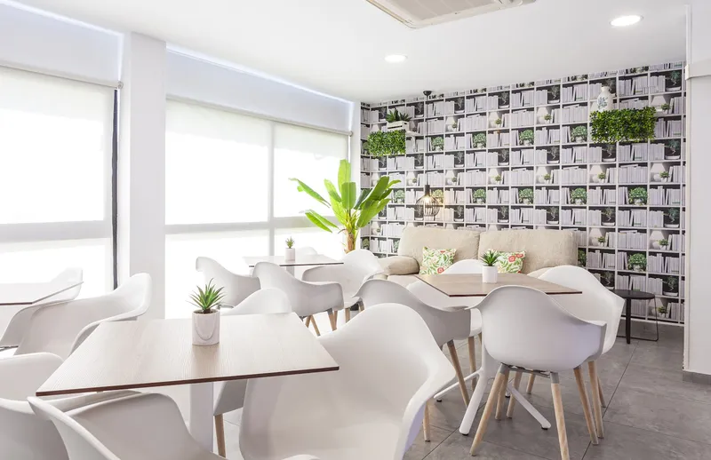 Golden: Dining room, White chairs and tables by large windows