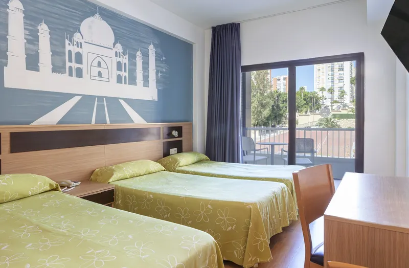 Golden: Triple room, Three beds below a Taj Mahal mural