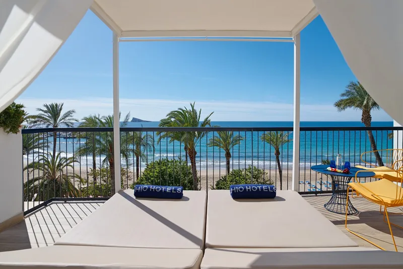Porto Poniente: Sea-view terrace, Daybed under a canopy facing the sea and palms