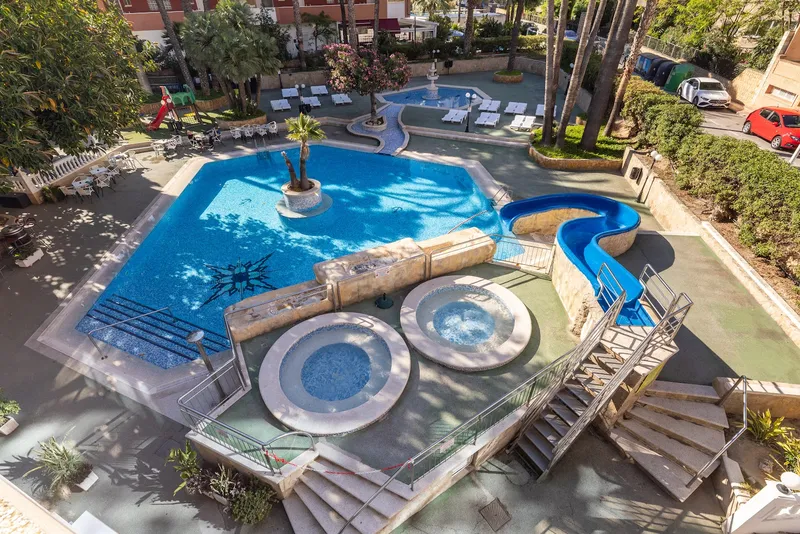Medsur Alone: Pools from above, Pool with slide, round hot tubs and loungers