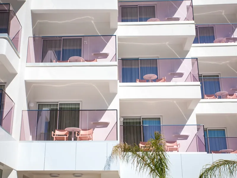 Ambassador Playa II: Balconies, Pink-trimmed balconies over the gardens