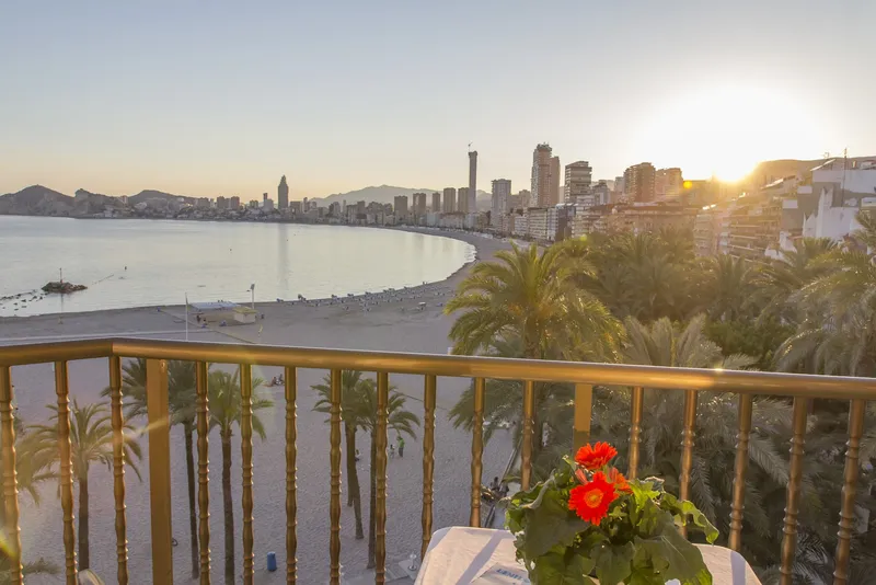 Colón: Balcony view, Balcony over palm trees and the beach at sunset