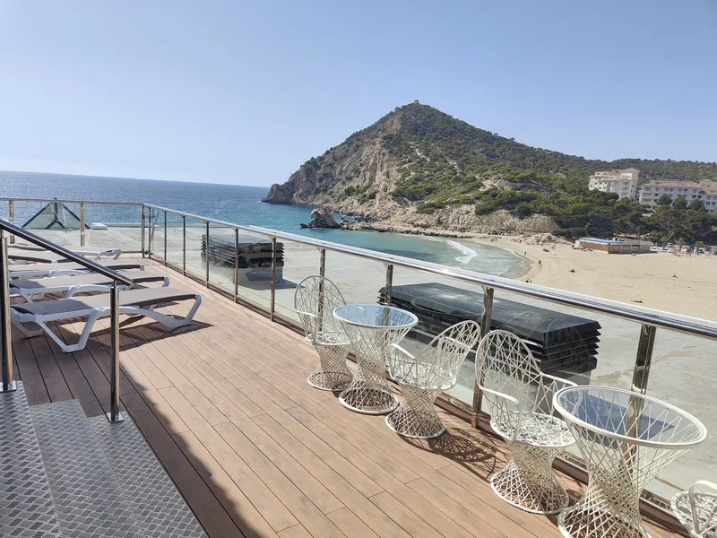 La Cala: Sun terrace, Deck with loungers above the cove and beach