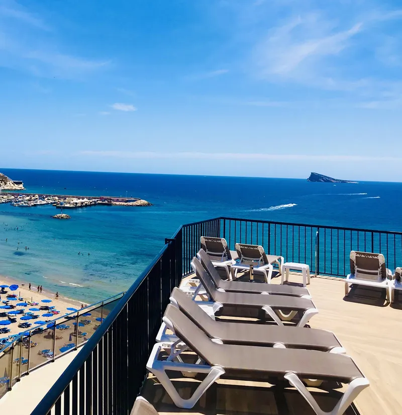 Marconi: Sun terrace, Loungers on a terrace looking over the bay and island