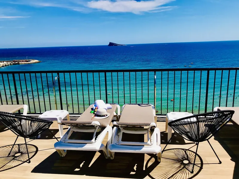 Marconi: Sea-view terrace, Loungers and chairs by a railing facing the sea