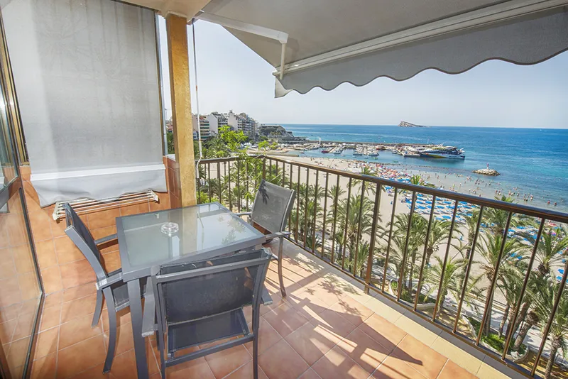 Montemar: Sea-view balcony, Balcony table overlooking the palm-lined beach and bay