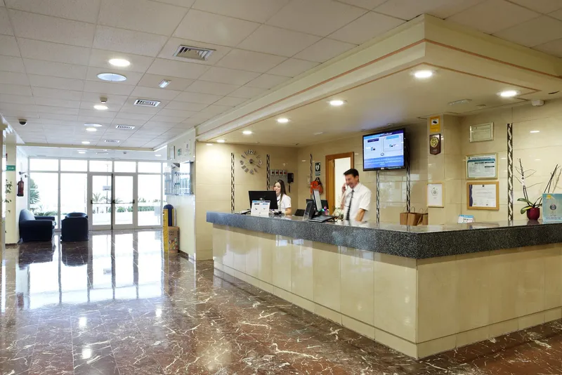 Poseidón Playa: Reception, Reception desk and marble-floored lobby