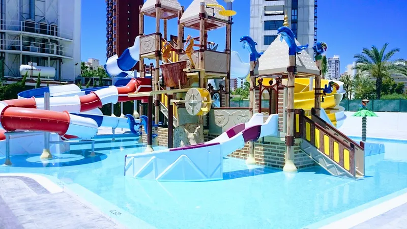 Rosamar: Kids water park, Children's splash pool with slides and climbing frame