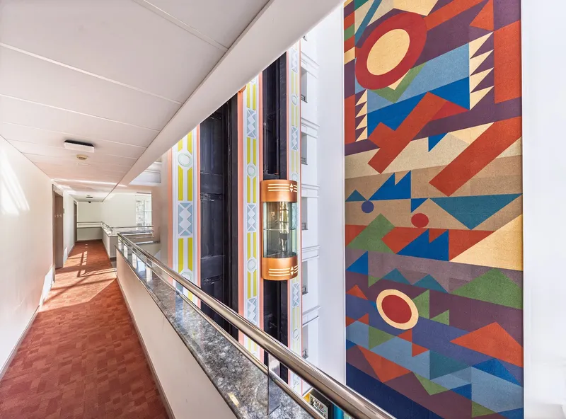 Tropic Relax: Corridor, Carpeted gallery corridor overlooking the atrium and lifts