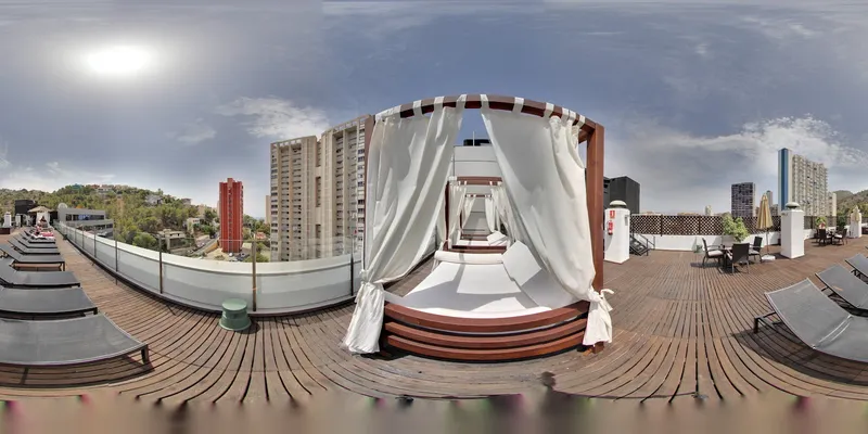 Aqua Rock Gardens: Rooftop terrace, Panorama of a canopy daybed and loungers