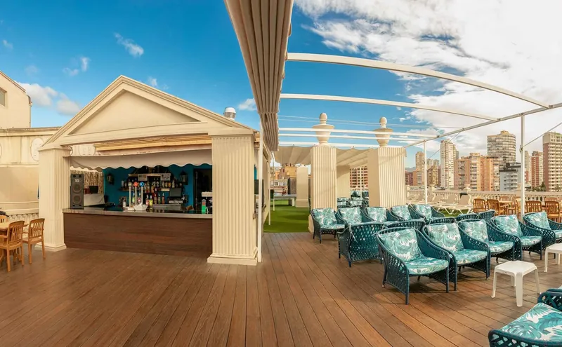 Magic Cristal Park: Rooftop terrace, Terrace bar with loungers above the town