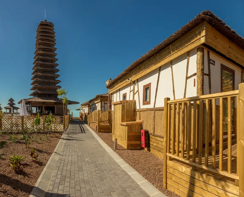 Magic Natura: Lodges, Wooden lodges with a path and pagoda tower