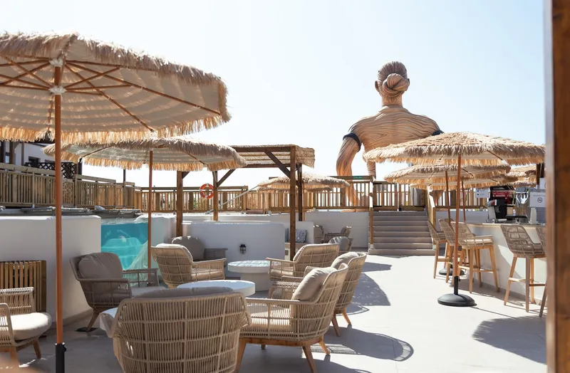 Magic Pirates: Pool bar terrace, Wicker armchairs under straw parasols near a small pool