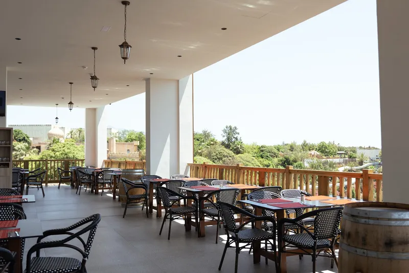 Magic Pirates: Covered terrace, Terrace tables with lanterns overlooking the gardens