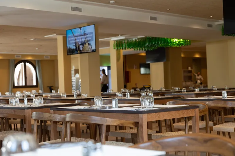 Magic Pirates: Restaurant, Long wooden tables laid with glasses in a large hall