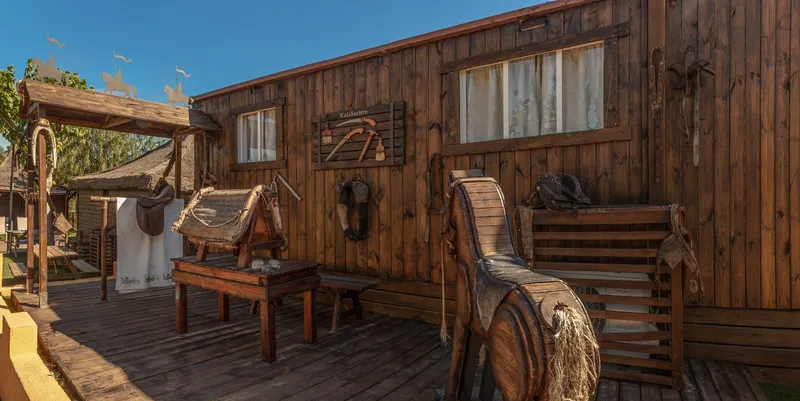 Magic Robin Hood: Lodge terrace, Wooden lodge porch with rustic furniture