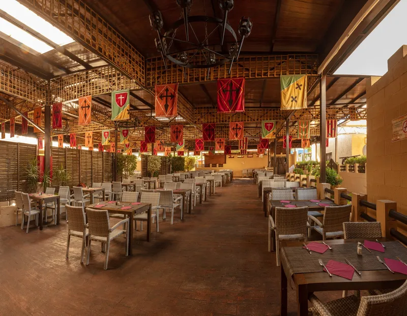 Magic Robin Hood: Restaurant, Covered dining area with banners and tables