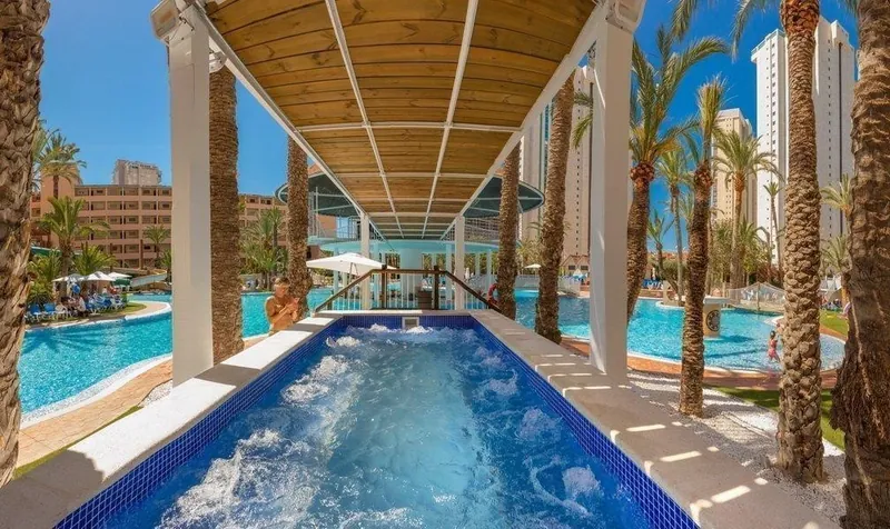 Magic Tropical Splash: Hot tub, Covered hot tub beside the pools