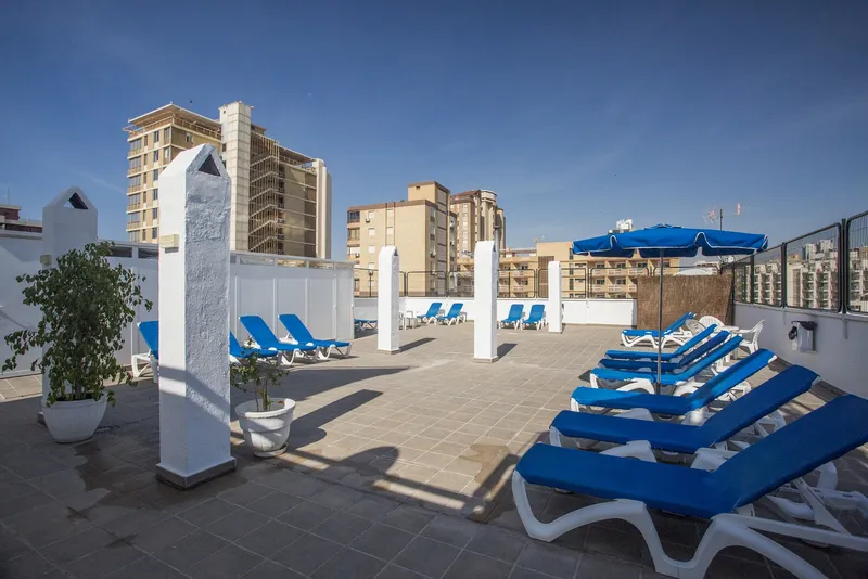 Magic Villa: Sun terrace, Sun terrace with blue loungers and parasols