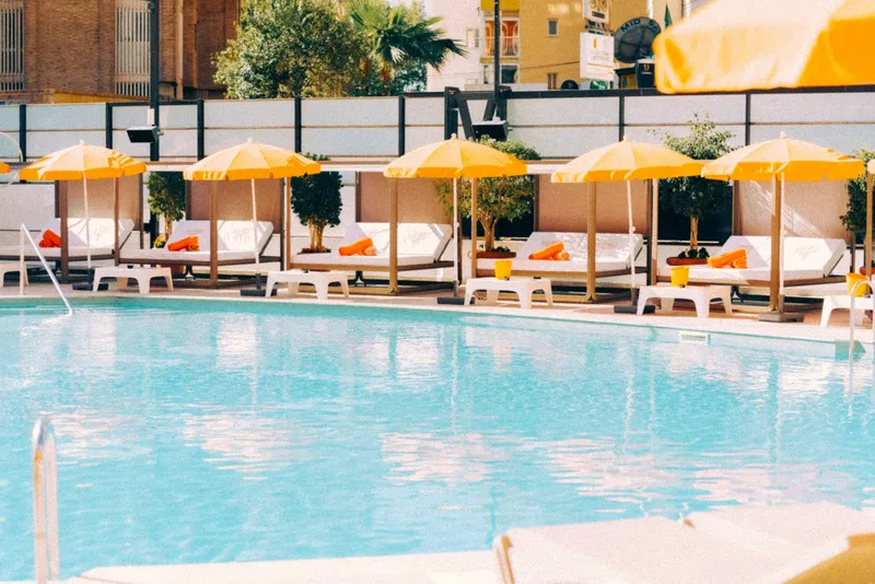 Marina Resort: Pool, Pool with yellow parasols and daybeds