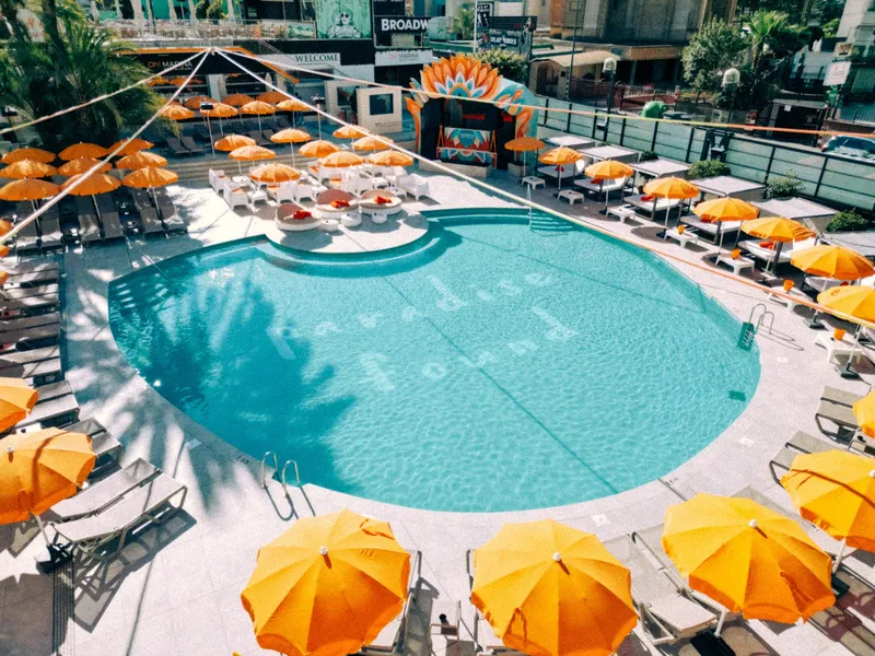 Marina Resort: Pool from above, Curved pool ringed by orange parasols and loungers