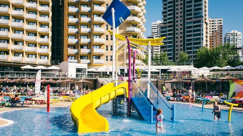 Hotel Rio Park: Kids' slides, Water play frame with yellow slides beside the pool