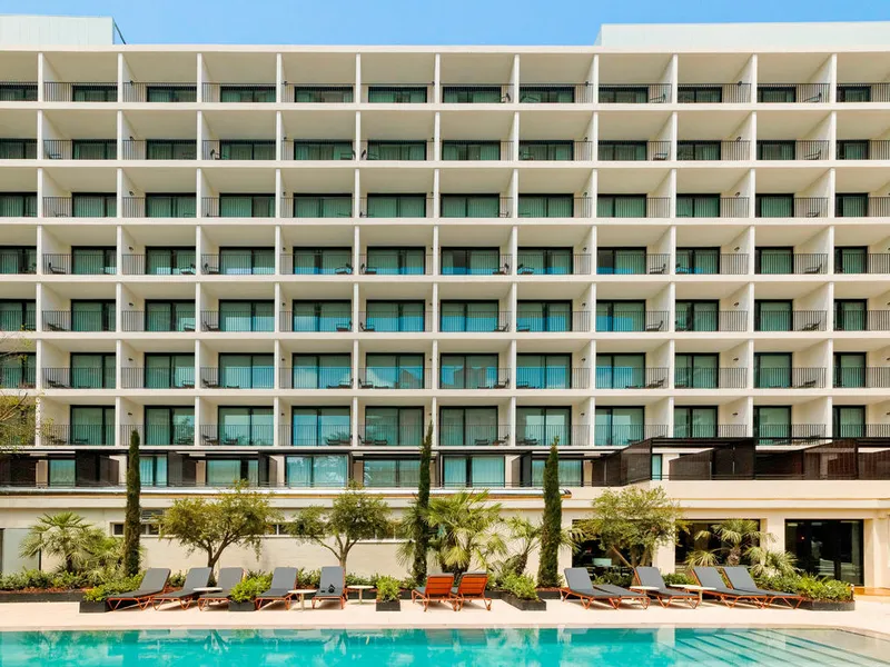 Mercure: The hotel, Hotel facade with balconies above the pool