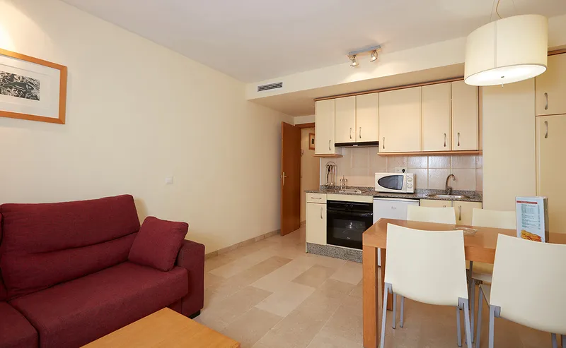 Milord's: Apartment, Sofa, dining table and fitted kitchen in one room