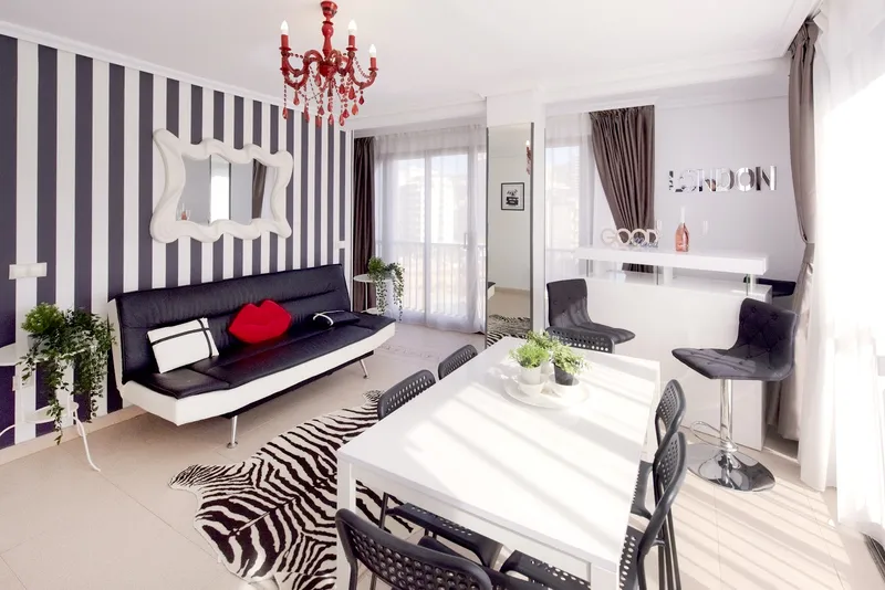 Pretty Payma: Living room, Sofa bed, dining table and striped wall